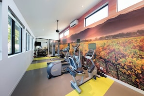 Stay fit and active in this well-equipped gym with treadmills, stationary bikes, and weight machines.
