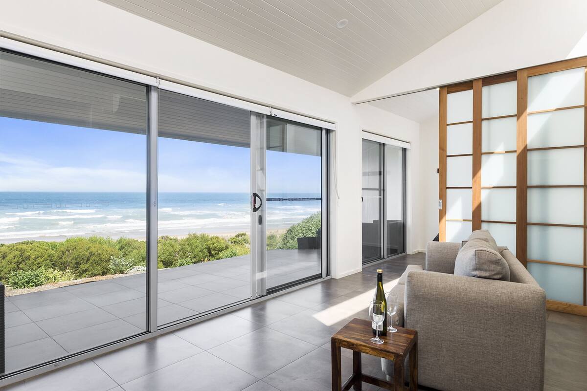 Two Bedroom Beach View Apartments | Living area | TV
