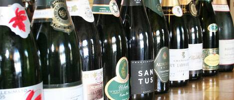 A row of wine bottles on a shelf.