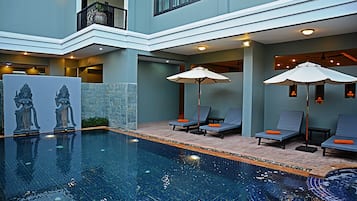 Outdoor pool, open 7 AM to 10 PM, pool loungers