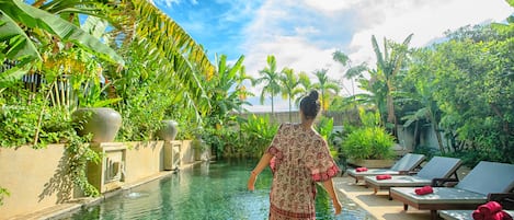 Outdoor pool, open 6:00 AM to 10:30 PM, pool loungers