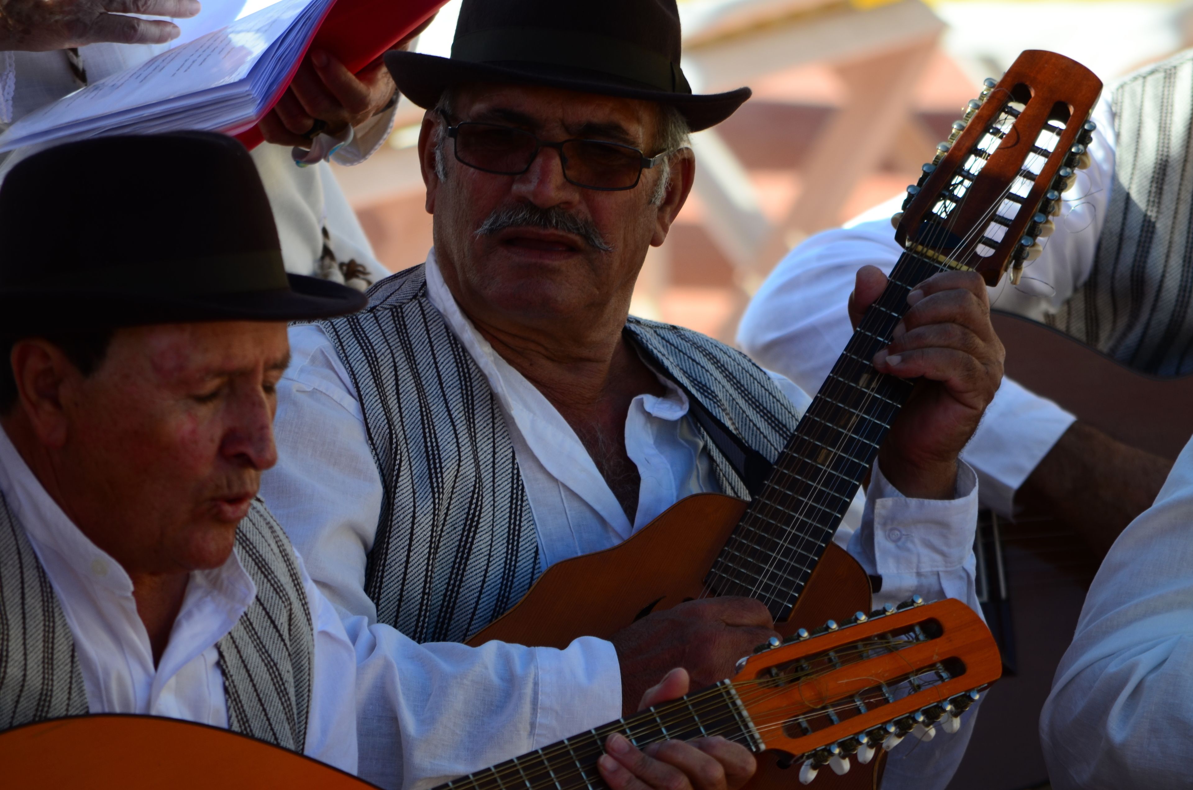 A man playing a guitar.