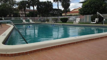 Outdoor pool, pool umbrellas, sun loungers