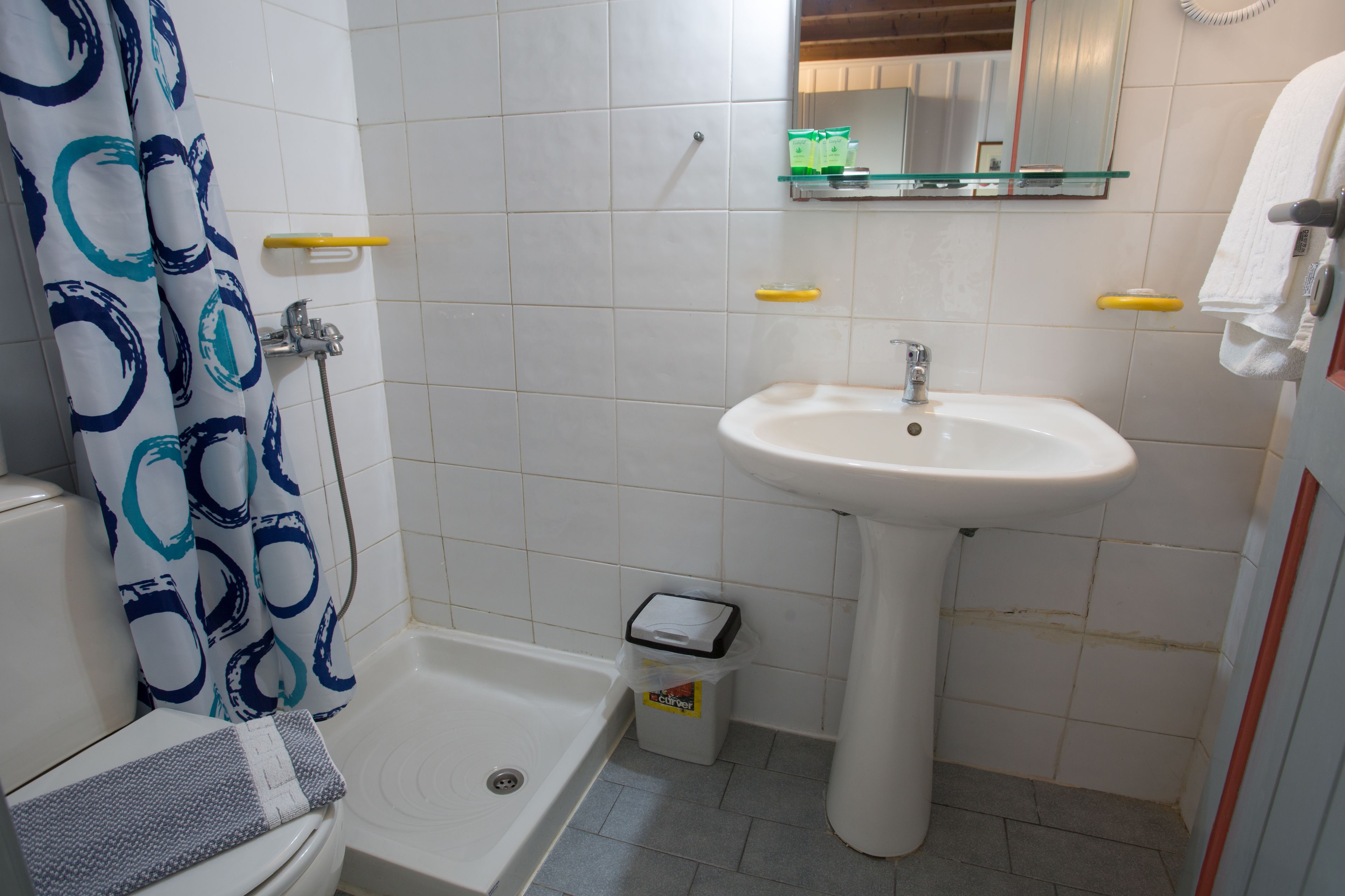 A bathroom with a bathtub, a sink, and a toilet.