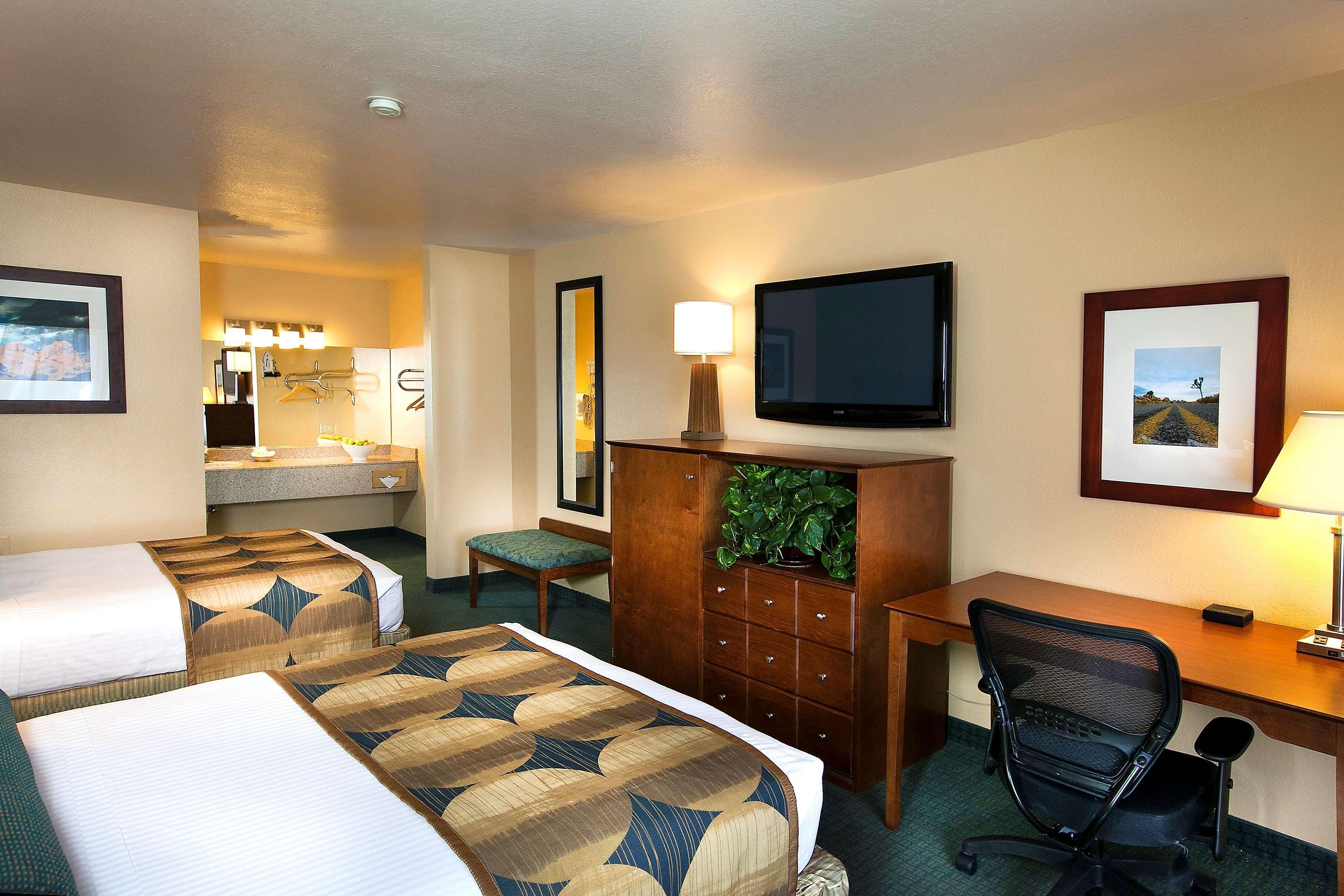 Desk, laptop workspace, blackout drapes, iron/ironing board