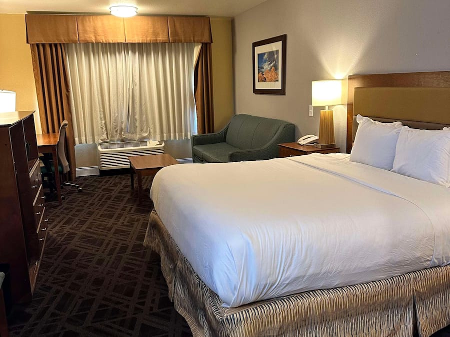 Desk, laptop workspace, blackout curtains, iron/ironing board