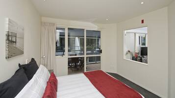 Apartment, 2 Bedrooms, Partial Sea View | 1 bedroom, pillowtop beds, minibar, in-room safe