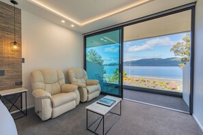 Tanara Luxury Studio Suite - ADULTS ONLY | Living area | Flat-screen TV