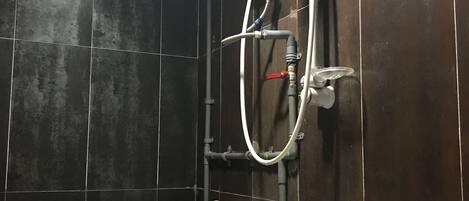 A bathroom with a toilet, bidet, and sink.