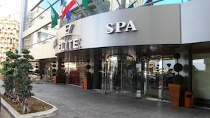A modern spa building with a curved entrance and glass doors. - Elite Hotel & Spa (Beirut)