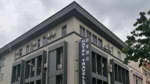 A hotel with a sign indicating it is a travel hotel. - Hotel Traveller (Kota Kinabalu)