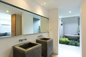 Separate bathtub and shower, rainfall showerhead, free toiletries