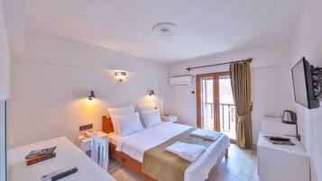 Habitación clásica | Ropa de cama de alta calidad y minibar