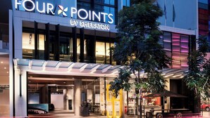A modern hotel facade with a prominent sign reading "FOUR POINTS BY SHERATON". - Four Points by Sheraton Brisbane (Brisbane)