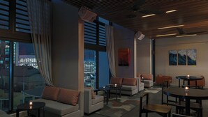 A modern lounge with sofas, tables, and artwork. - Four Points by Sheraton Brisbane (Brisbane)