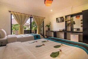 A hotel room with two beds, a TV, a desk, and a small refrigerator. - La Residence WatBo Hotel (Siem Reap)