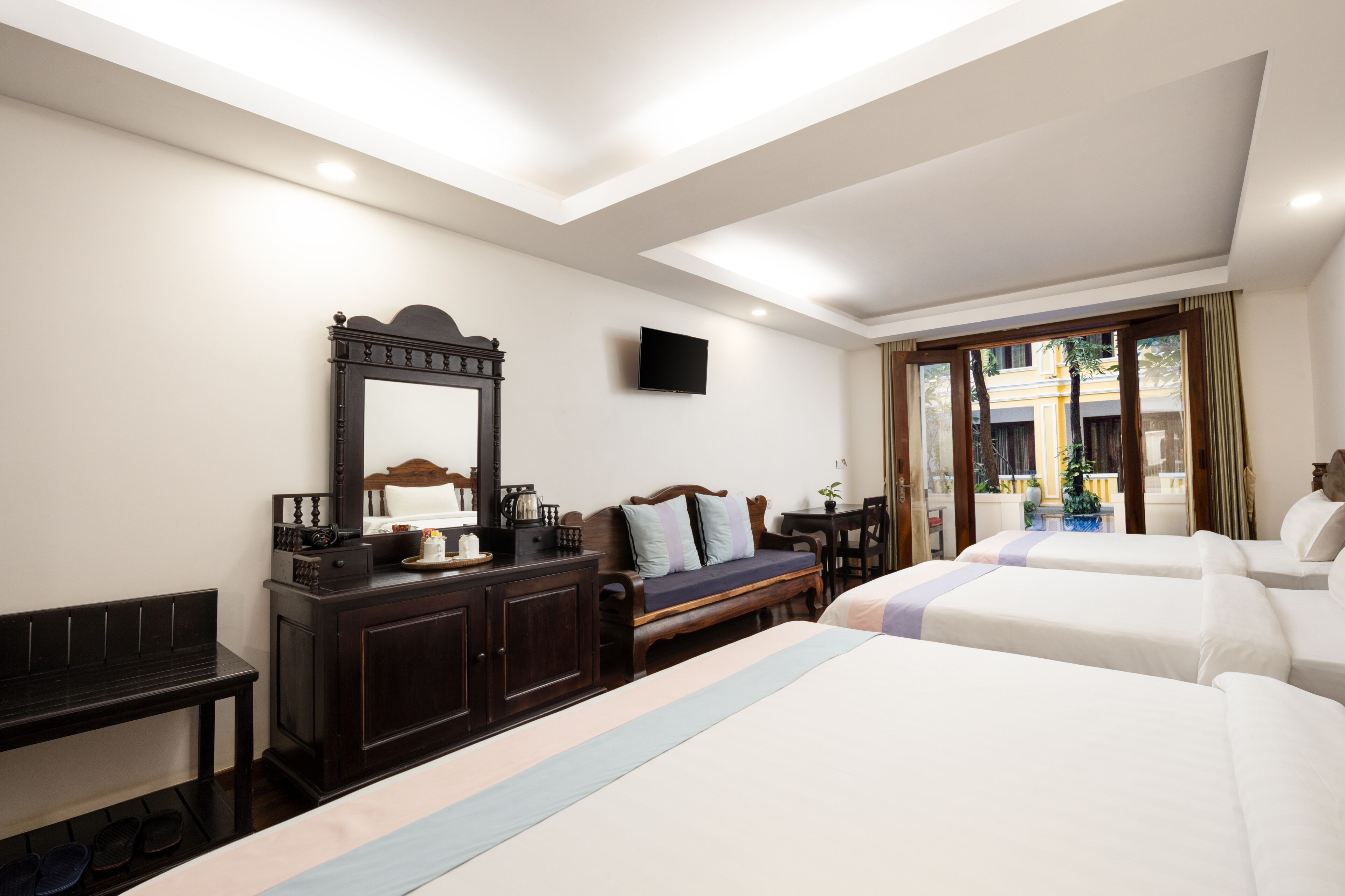 family room | premium bedding, select comfort beds, minibar, in-room safe
