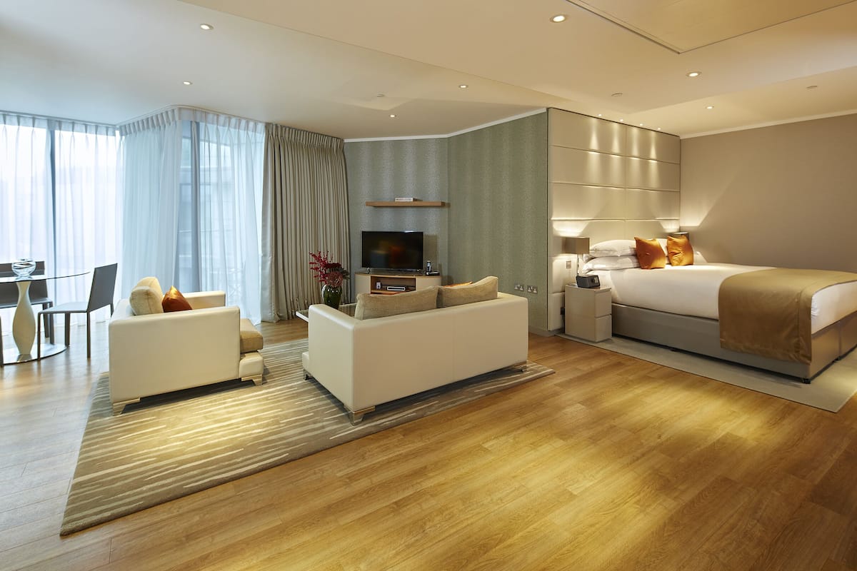 Studio with Balcony | Living area | Flat-screen TV, iPod dock