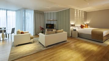 Luxury Studio | Living area | Flat-screen TV, iPod dock