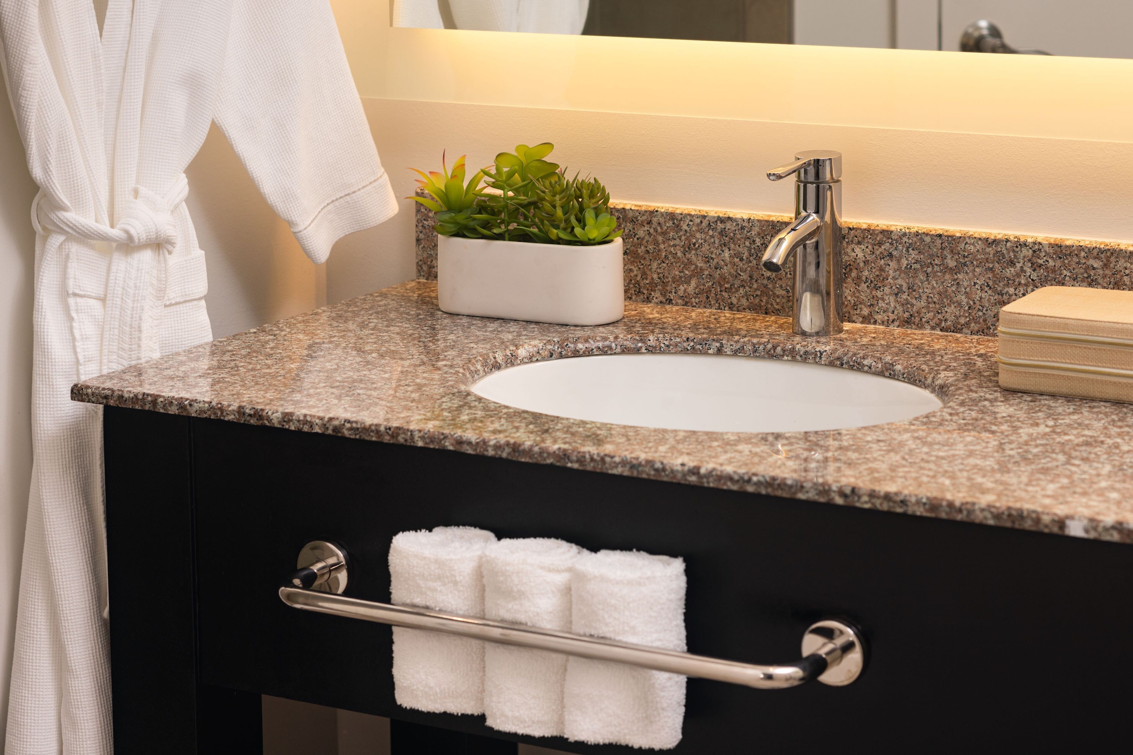 designer toiletries, hair dryer, bathrobes, towels