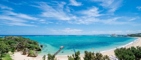 On the beach, sun loungers, beach umbrellas, beach towels