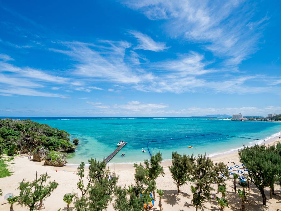 On the beach, sun-loungers, beach umbrellas, beach towels
