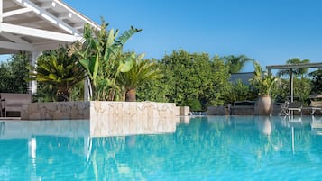 2 outdoor pools, open 10:00 AM to 8:00 PM, pool umbrellas, pool loungers