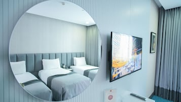 Suite familiar | Sábanas italianas Frette, ropa de cama de alta calidad, minibar