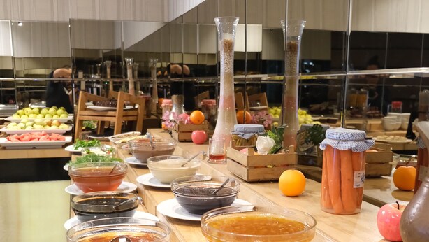 A buffet table with various food items and condiments. - Asia City Hotel Istanbul (Istanbul)