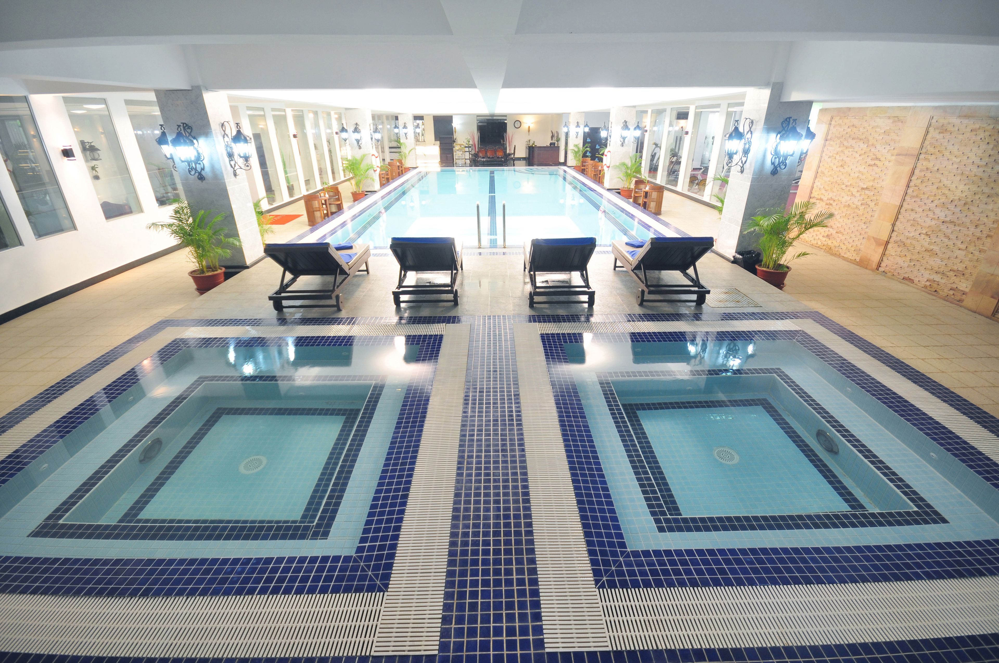 indoor pool, outdoor pool, pool umbrellas, pool loungers