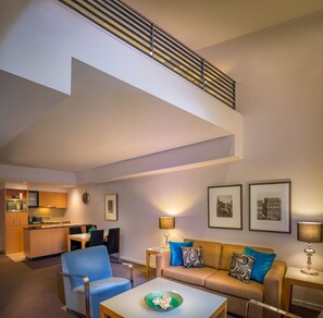 Heritage Loft Apartment | Living area | 40-inch flat-screen TV with digital channels - Treasury on Collins (Melbourne)