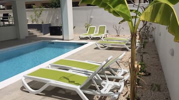 Seasonal outdoor pool, pool umbrellas, sun loungers