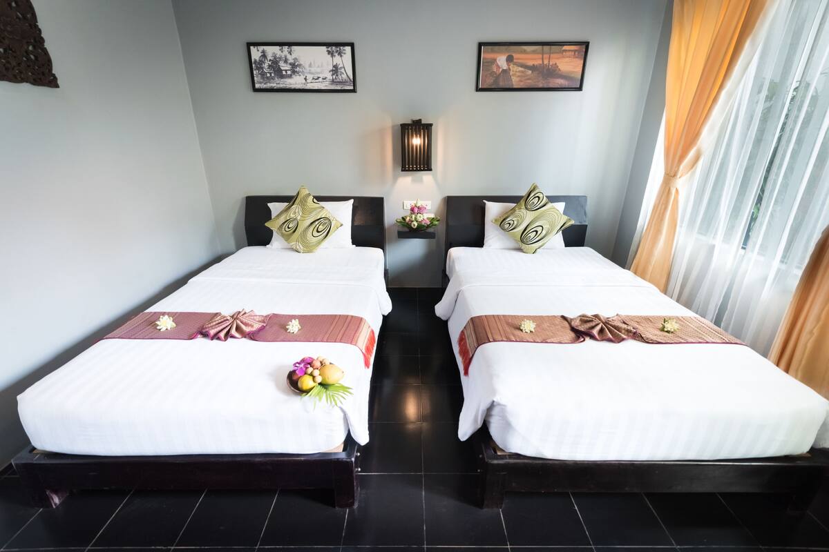 Deluxe Twin Room, Pool View | Minibar, in-room safe, desk, soundproofing