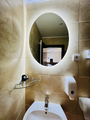 Economy Room | Bathroom | Shower, free toiletries, hair dryer, towels