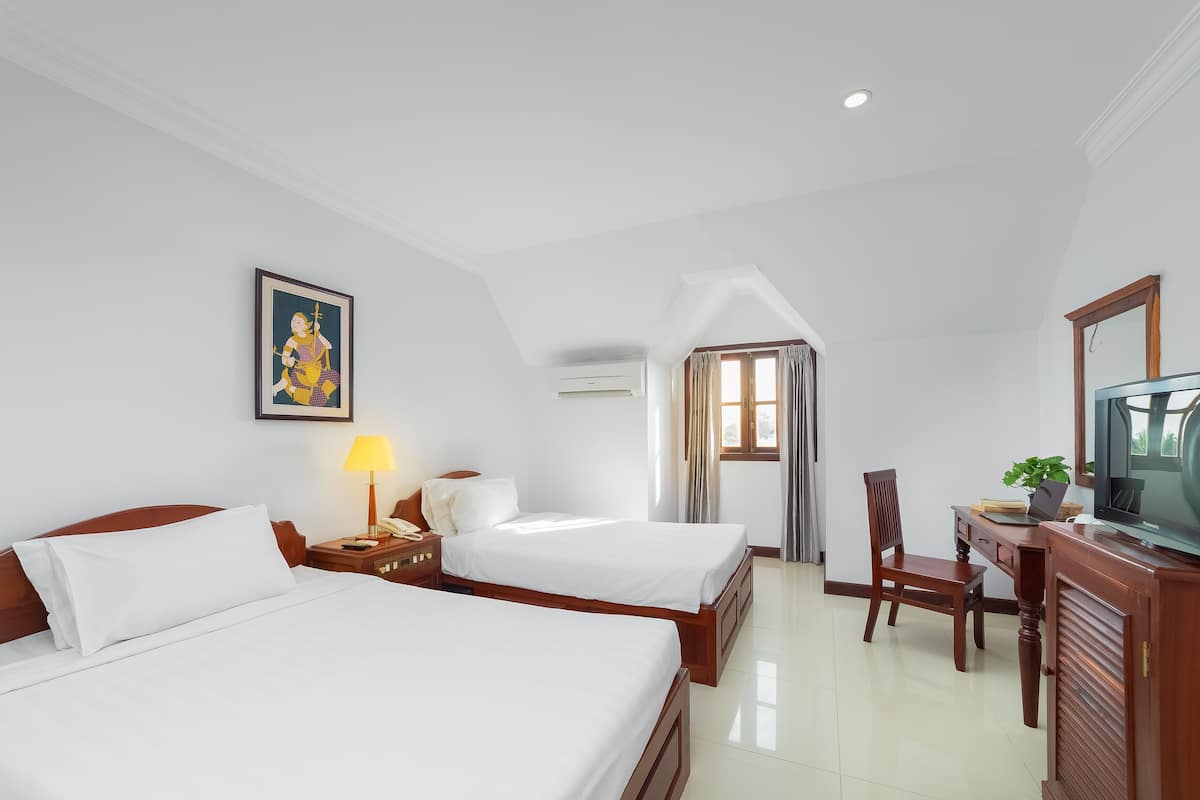 Superior Twin Room | Minibar, in-room safe, desk, iron/ironing board