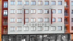 A multi-story building with the name "GRANDIOR" prominently displayed on the facade.