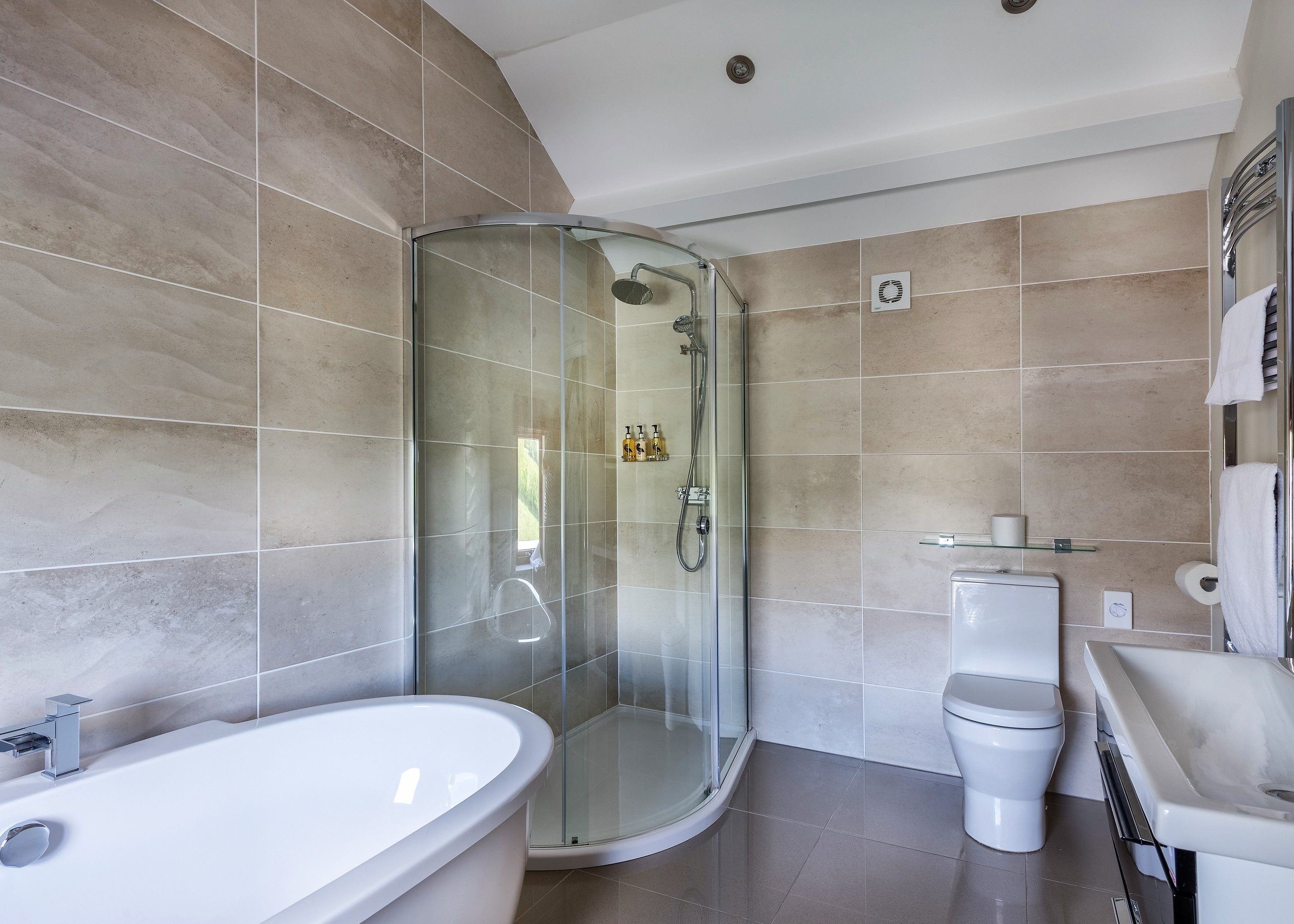 designer toiletries, hair dryer, bathrobes, towels