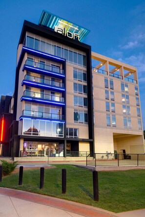 A modern hotel with a prominent 'aloft' sign, multiple floors, and a well-lit facade. - Aloft by Marriott Oklahoma City Downtown - Bricktown (Oklahoma City)