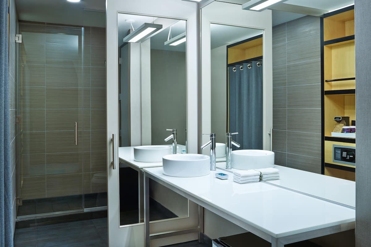 Designer toiletries, hair dryer, towels, soap