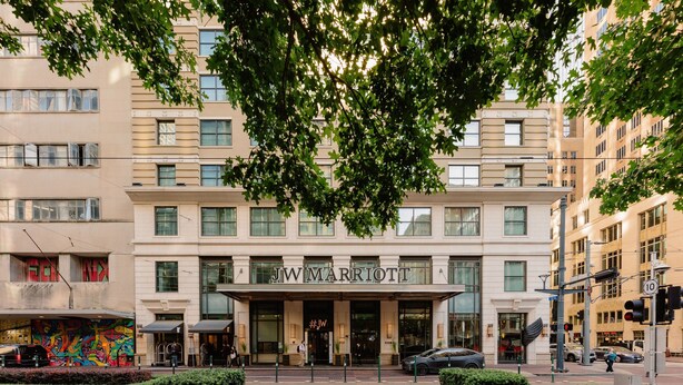 A JW Marriott hotel with a classic facade, large windows, and a prominent entrance. - JW Marriott Houston Downtown (Houston)