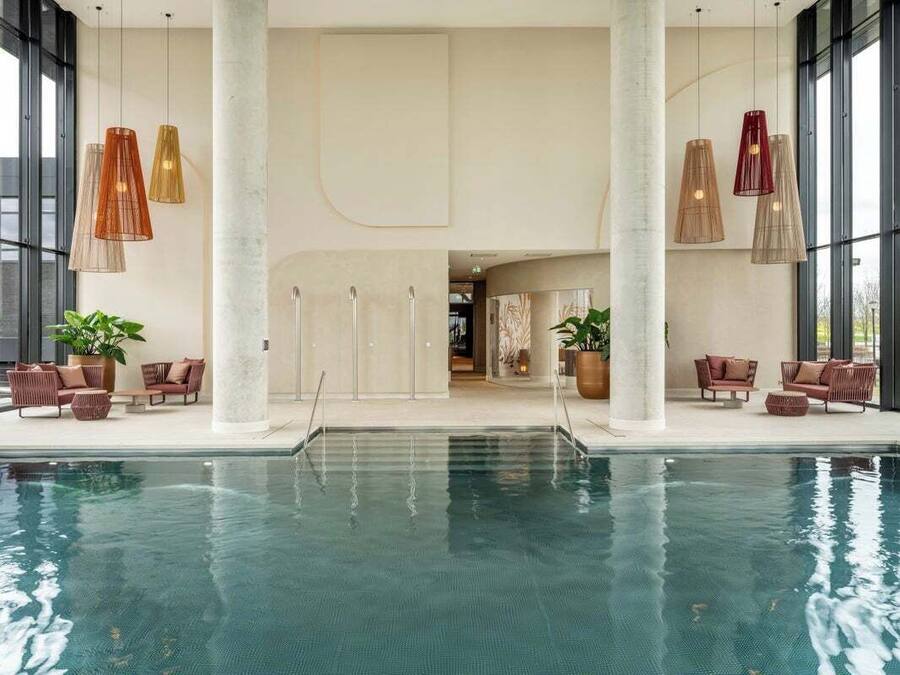 Indoor pool, open 7:00 AM to 11:00 PM, pool loungers