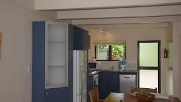 Full-sized fridge, microwave, stovetop, dishwasher