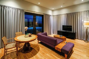Penthouse | Living area | 40-inch LED TV with cable channels, TV - The Kirana Canggu Hotel (Canggu)