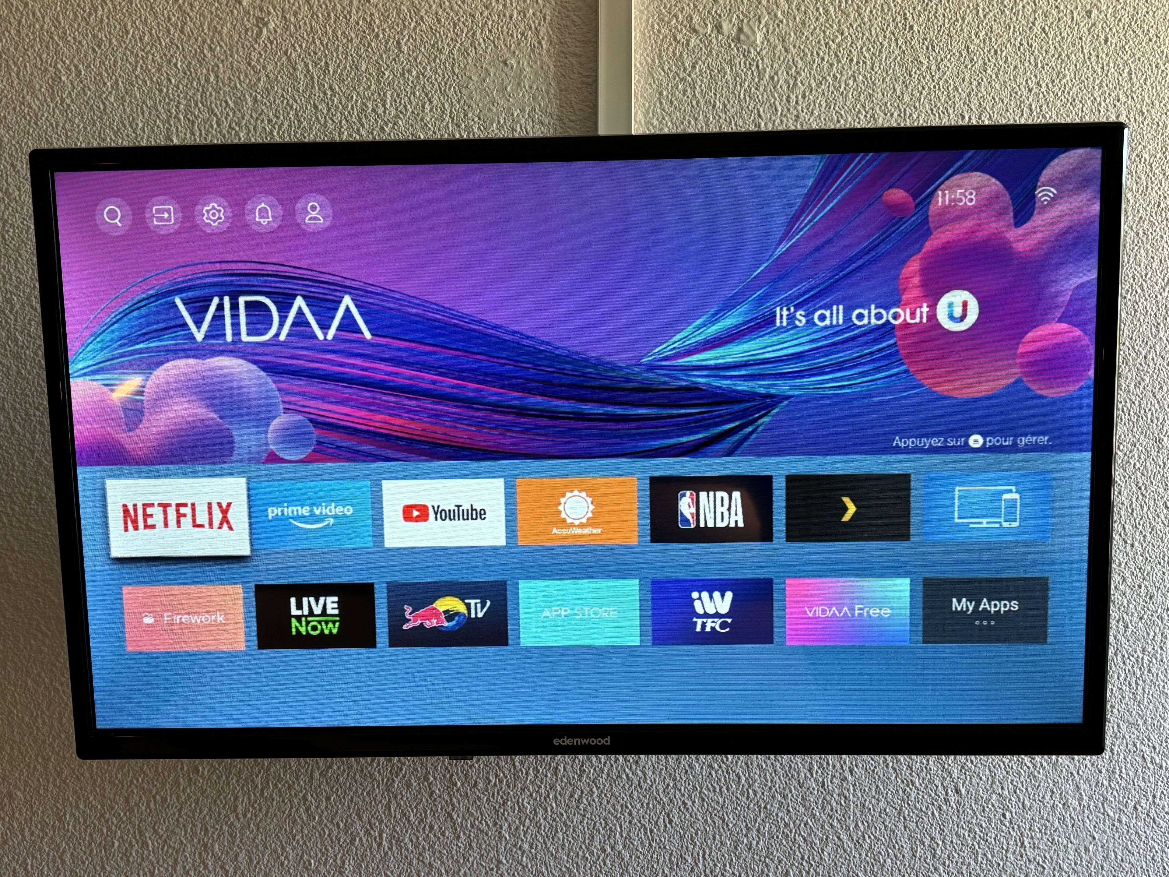 A TV screen displaying a VIVAa interface with various streaming services and apps.