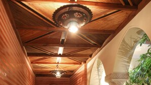 A traditional hammam with a central pool, wooden beams, and arches. - Riad Sidi Ayoub (Marrakech)