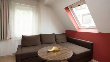 Comfort-Doppelzimmer | Wohnzimmer | Flachbildfernseher