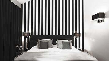 Habitación Deluxe | Ropa de cama de alta calidad y caja de seguridad en la habitación