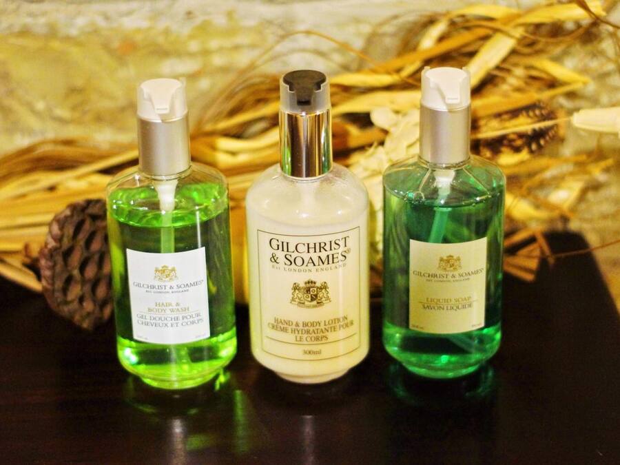 Three bottles of Gilchrist & Soames hand and body lotion.