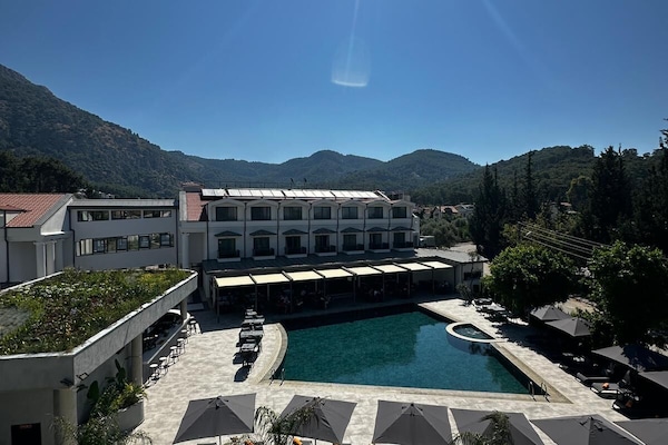 Indoor pool, seasonal outdoor pool, pool umbrellas, sun loungers