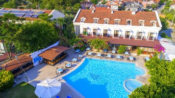 Indoor pool, seasonal outdoor pool, pool umbrellas, pool loungers